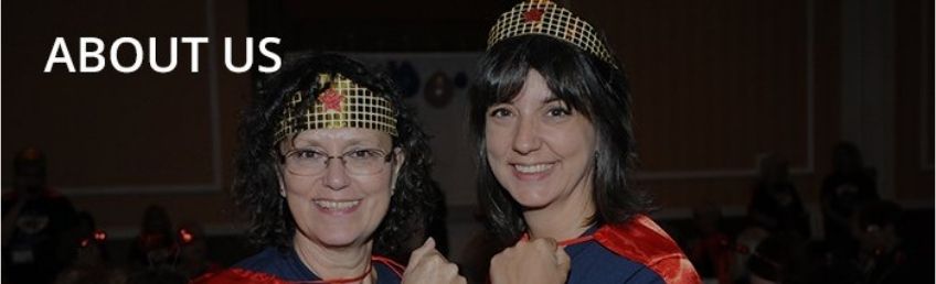 ESA community members pose in Wonder Women costumes at ESA's annual benefit for St. Jude Children's Research Hospital, the IC Challenge.